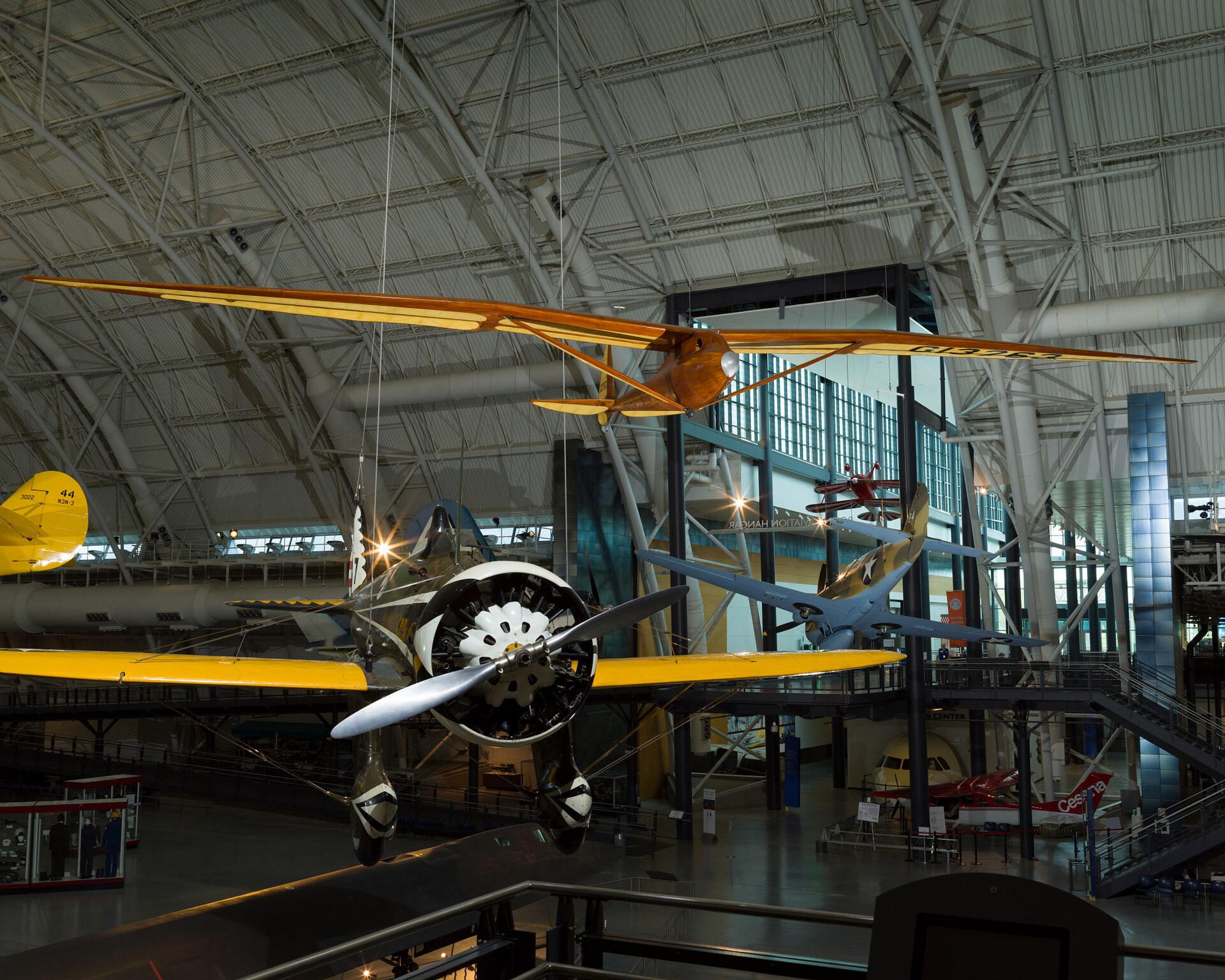 Monoplane glider with strut-braced, gull-type wing mounted high on monocoque fuselage; wooden construction with steel and aluminum fittings and controls; fuselage and wing leading edge covered with mahogany plywood. Fuselage skin applied over laminated Spruce bulkheads. Landing gear consists of single-wheel and .... [size?] tire mounted beneath forward fuselage, spring-steel tail skid beneath rudder. Cockpit covered with hood made from laminated Spruce bulkheads and covered with Mahogany plywood. Circular openings cut into hood on either side of pilot's head. Instrumentation: altimeter, airspeed, variometer plus a bank-and-turn indicator powered by low-speed venturi tube installed on retractable mount beneath right wingroot. Areas aft of wing spar and all control surfaces covered with glider cloth. Cloth is doped directly onto ribs and plywood skin without stitching for smooth finish. Constant-chord wing from fuselage to mid-span, tapered profile from mid-span to wingtip; constant-chord, split-trailing edge flaps and high-aspect ratio ailerons. A Gö 549 airfoil is used at the wing root, becoming symmetrical at the tip. All-flying elevator mounted on duraluminum torque-tube, rudder hinged to box-beam post, both surfaces built up from Spruce and covered with glider cloth. In 1933, Richard C. du Pont teamed with Hawley Bowlus and the two men set up shop in San Fernando, California, to build gliders. Their most successful competition sailplane was the Senior Albatross. The Bowlus shop built four and Warren Eaton bought the third in May 1934. He named the sailplane "Falcon" and flew it often including over the Blue Ridge Mountains from an airfield at Big Meadows, VA, in 1934. Eaton had served in the U. S. Army Air Service during World War I and flown SPAD XIII fighters (see NASM collection) in the 103rd Aero Squadron, 3rd Pursuit Group, at Issoudon, France, from August 27, 1918, until Armistice Day, November 11. Eaton led the effort to found the Soaring Society of America in 1932 and became the organization's first president. Long before he designed and built the Bowlus-du Pont "Falcon," William Hawley Bowlus had contributed to aviation history. In 1926, T. Claude Ryan hired him as factory manager at the Ryan Airlines, Inc., at San Diego, California. Late in February 1927, Bowlus and twenty Ryan workmen, supervised by chief engineer Donald A. Hall and Charles A. Lindbergh, built a long-range monoplane based on the Ryan M-2. Lindbergh christened the modified M-2 the "Spirit of St. Louis." It is said that Bowlus suggested several design features that Lindbergh approved and incorporated in the finished airplane. Bowlus renewed his friendship with Lindbergh late in 1929. He taught the ocean flyer and his wife, Anne Morrow Lindbergh, to fly sailplanes and in January 1930, both Charles and Anne completed their first solo glider flights. Hawley Bowlus developed the Senior Albatross series from a design that he called the Bowlus Super Sailplane. In Germany, designers and pilots led the world in building and flying high-performance gliders and Bowlus was strongly influenced by their work. He and German glider pioneer Martin Schempp taught courses in aircraft design and construction at the Curtiss-Wright Technical Institute in Glendale, California. The two instructors led a group of students who built the Super Sailplane in 1932. The wing of the Super was nearly a copy of the wing used on the German "Wein" sailplane designed and flown with great success in 1930 and 1931 by Robert Kronfeld. Both the Super Sailplane and the Senior Albatross employed the same Goettingen 549 wing airfoil and even the tips of the control surfaces curved to almost identical contours. When Bowlus built the Senior Albatross series, the cockpit enclosure closely resembled another record-setting and influential German sailplane called the "Fafnir" and designed by Alexander Lippisch specifically for pilot Gunther Groenhoff. Richard C. du Pont was also an important character in the history of the Senior Albatross. By the time he finished high school, this heir to the Delaware-based chemical empire could fly gliders with some skill. During his first year at the University of Virginia, he founded a campus soaring club. His passion for motor-less flight drew him farther away from traditional academics and in 1932, he transferred to the Curtiss-Wright Technical Institute. Mr. du Pont was probably among the students who built the Super Albatross. In 1933, du Pont teamed with Hawley Bowlus and the two men set up shop in San Fernando, California, to build gliders. Bowlus furnished the design expertise and performed much of the construction while du Pont supplied enthusiasm, financing, and additional labor. The Bowlus-DuPont Sailplane Company became an official entity in 1934, not in California but in Delaware. The firm folded in September 1936 but during its short life, the small factory built four examples of the Senior Albatross. No two were constructed exactly alike and a short history of each follows: -Prototype Sr Albatross called the Super Sailplane, 60-ft span straight wing, built 1932, landed in the ocean and destroyed fall 1932. -First two production Sr. Albatrosses, 62-ft span gull wing, a single-seat named Albatross I, and a two-seater named Dragonfly with pod fuselage and a metal boom aft fuselage, both with gull wings but no flaps, purchased by Richard du Pont in 1933. Dragonfly crashed at Elmira 1933 and later burned by du Pont. Du Pont sold Albatross I to Chet Decker. -Third production Sr. Albatross built to order for Warren Eaton, named Falcon and fitted with flaps, Eaton accepted the sailplane May 1934, flown at Elmira in national meet that year, Eaton died end of 1934, Eaton’s widow Genevieve donated to Smithsonian Institution in 1935. -Fourth production Sr. Albatross, Bowlus built a sister ship to Eaton’s Falcon called Albatross II and fitted with flaps like Falcon, sold to du Pont who flew it in 1934 national contest at Elmira. Flown many times but not owned by Lew Barringer, damaged by wind in 1935 and wreck sold to Jack O’Meara in 1935. All four sailplanes did have 'gull' wings (each wing was bent down slightly at about mid-span) and this feature differentiates these airplanes from the prototype Super Sailplane. Bowlus fitted two with wing flaps, Falcon and Albatross II, rather than spoilers, for better speed and altitude control during landing. Mahogany plywood skinned the Falcon and spruce plywood covered the other three aircraft, Dragonfly, Albatross I, and Albatross II. Bowlus sold each of these handcrafted airplanes for $2,500. Performance calculations revealed a best glide ratio of 23:1 when flying at 64.4 km/h (40 mph). If it became necessary, the pilot of a Senior Albatross could push his mount well over 161 km/h (100 mph) as long as he never exceeded a speed of 241.5 km/h (150 mph). With an accomplished pilot at the controls, the Senior Albatross could fly better than any other American sailplane and they were very pleasing to look at, too. A quotation from the July 1934 issue of "Aviation," a popular aviation periodical of the day, sums up one writer's impressions of the Senior Albatross: "Few flying machines have ever exhibited such an extraordinary combination of workmanship, finish, and aerodynamic refinement, so that it seems quite safe to say that the new ships represent the ultimate in soaring design practice in the United States, if not the world." The pilots who flew the Senior Albatross nearly dominated American competitive soaring. In September 1933, Richard du Pont flew the first Senior Albatross, Albatross I, at the fourth U. S. National Soaring Championships held at Elmira, New York. On September 21, du Pont set the American sailplane distance record by flying 196 km (121.6 miles). On June 25, 1934, he flew to within 3.2 km (2 miles) of New York City and established a new world distance record of 254 km (158 miles). On June 30, 1934, du Pont set the U. S. altitude record for sailplanes by climbing to 1,892 m (6,223 ft). The following year, Lewin Barringer soared du Pont’s Albatross II parallel to the ridges of the Allegheny Mountains for 250.3 km (155.5 miles). Du Pont sold Albatross I to Chet Decker who competed with the sailplane in the 1936 U. S. National contest held at Elmira, NY. In May 1934, Warren E. Eaton acquired from Hawley Bowlus the Senior Albatross Falcon that is now preserved at NASM. Eaton was already a veteran aviator. He had joined the U. S. Army Air Service and flown SPAD XIII fighters (see NASM collection) in the 103rd Aero Squadron, 3rd Pursuit Group, at Issoudon, France, from August 27, 1918, until Armistice Day, November 11. He was credited with downing one enemy aircraft in aerial combat. After the war, Eaton founded the Soaring Society of America and became the organization's first president. Eaton had commissioned Bowlus to build a Senior Albatross after he saw Richard du Pont fly the Albatross I at the U. S. Nationals the year before. Eaton asked Bowlus to fit flaps to his aircraft and to skin it with mahogany plywood. He christened it Falcon and it bore the federal aircraft registration number G13763. Several gold decals edged in black also appeared at various locations on the fuselage. "Warren E. Eaton" and "Falcon" appeared on both sides of the nose. A stylized albatross and the company motto "On the Wings of an Albatross" were applied to the vertical fin above the words "Bowlus-du Pont Sailplane Company." Eaton first flew the glider at San Diego. In June, he brought it to the national contest atop Harris Hill outside Elmira, New York. At Big Meadows, Virginia, Eaton set the American soaring altitude record, 2,765 m (9,094 ft), during September 1934. Three months later, Eaton died in Florida flying a Franklin primay glider. In 1935, Warren Eaton's widow, Genevieve, donated the Falcon to the Smithsonian Institution. It arrived in Washington on May 28 and a few days later, museum personnel suspended the glider from the ceiling of the West Hall of the Arts and Industries Building where it remained on display for many years. Wingspan: 18.8 m (61 ft 9 in) Length: 7.2 m (23 ft 7 in) Height: 1.6 m (5 ft 4 in) Weight: Empty, 153 kg (340 lb) Gross, 236 kg (520 lb) References and Further Reading: Blacksten, Raul. "On the Wings of an (Senior) Albatross." Unpublished manuscript, May 2000. Crouch, Tom D., ed. "Charles A. Lindbergh - An American Life." Washington: Smithsonian Institution Press, 1977. Frebert, George, and Haskell, Debbie, ed. "Deleware Aviation History." Dover: Litho Printing Co., 1998. Ross, Harland. "A Bowlus Outline," "Bungee Cord," Vol. 6 No. 4, Winter 1980. Simons, Martin. "The World's Vintage Sailplanes 1908-1945." Melbourne, Australia: Kookaburra, 1986. Senior Albatross curatorial file, Aeronautics Division, National Air and Space Museum. Russell Lee, 7/23/12, rev. 11/5/20