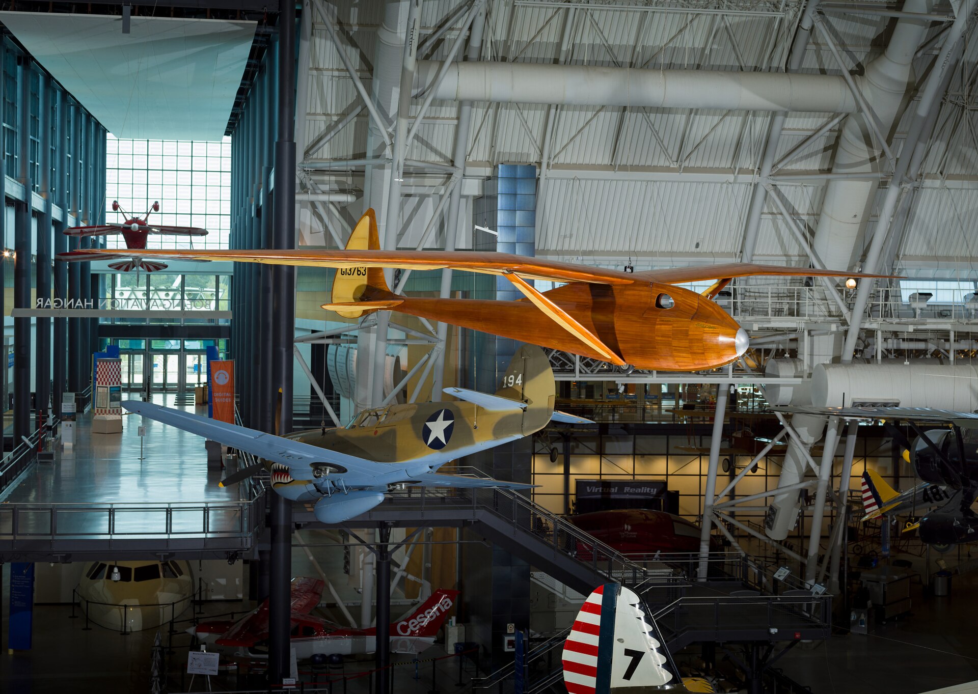 Monoplane glider with strut-braced, gull-type wing mounted high on monocoque fuselage; wooden construction with steel and aluminum fittings and controls; fuselage and wing leading edge covered with mahogany plywood. Fuselage skin applied over laminated Spruce bulkheads. Landing gear consists of single-wheel and .... [size?] tire mounted beneath forward fuselage, spring-steel tail skid beneath rudder. Cockpit covered with hood made from laminated Spruce bulkheads and covered with Mahogany plywood. Circular openings cut into hood on either side of pilot's head. Instrumentation: altimeter, airspeed, variometer plus a bank-and-turn indicator powered by low-speed venturi tube installed on retractable mount beneath right wingroot. Areas aft of wing spar and all control surfaces covered with glider cloth. Cloth is doped directly onto ribs and plywood skin without stitching for smooth finish. Constant-chord wing from fuselage to mid-span, tapered profile from mid-span to wingtip; constant-chord, split-trailing edge flaps and high-aspect ratio ailerons. A Gö 549 airfoil is used at the wing root, becoming symmetrical at the tip. All-flying elevator mounted on duraluminum torque-tube, rudder hinged to box-beam post, both surfaces built up from Spruce and covered with glider cloth. In 1933, Richard C. du Pont teamed with Hawley Bowlus and the two men set up shop in San Fernando, California, to build gliders. Their most successful competition sailplane was the Senior Albatross. The Bowlus shop built four and Warren Eaton bought the third in May 1934. He named the sailplane "Falcon" and flew it often including over the Blue Ridge Mountains from an airfield at Big Meadows, VA, in 1934. Eaton had served in the U. S. Army Air Service during World War I and flown SPAD XIII fighters (see NASM collection) in the 103rd Aero Squadron, 3rd Pursuit Group, at Issoudon, France, from August 27, 1918, until Armistice Day, November 11. Eaton led the effort to found the Soaring Society of America in 1932 and became the organization's first president. Long before he designed and built the Bowlus-du Pont "Falcon," William Hawley Bowlus had contributed to aviation history. In 1926, T. Claude Ryan hired him as factory manager at the Ryan Airlines, Inc., at San Diego, California. Late in February 1927, Bowlus and twenty Ryan workmen, supervised by chief engineer Donald A. Hall and Charles A. Lindbergh, built a long-range monoplane based on the Ryan M-2. Lindbergh christened the modified M-2 the "Spirit of St. Louis." It is said that Bowlus suggested several design features that Lindbergh approved and incorporated in the finished airplane. Bowlus renewed his friendship with Lindbergh late in 1929. He taught the ocean flyer and his wife, Anne Morrow Lindbergh, to fly sailplanes and in January 1930, both Charles and Anne completed their first solo glider flights. Hawley Bowlus developed the Senior Albatross series from a design that he called the Bowlus Super Sailplane. In Germany, designers and pilots led the world in building and flying high-performance gliders and Bowlus was strongly influenced by their work. He and German glider pioneer Martin Schempp taught courses in aircraft design and construction at the Curtiss-Wright Technical Institute in Glendale, California. The two instructors led a group of students who built the Super Sailplane in 1932. The wing of the Super was nearly a copy of the wing used on the German "Wein" sailplane designed and flown with great success in 1930 and 1931 by Robert Kronfeld. Both the Super Sailplane and the Senior Albatross employed the same Goettingen 549 wing airfoil and even the tips of the control surfaces curved to almost identical contours. When Bowlus built the Senior Albatross series, the cockpit enclosure closely resembled another record-setting and influential German sailplane called the "Fafnir" and designed by Alexander Lippisch specifically for pilot Gunther Groenhoff. Richard C. du Pont was also an important character in the history of the Senior Albatross. By the time he finished high school, this heir to the Delaware-based chemical empire could fly gliders with some skill. During his first year at the University of Virginia, he founded a campus soaring club. His passion for motor-less flight drew him farther away from traditional academics and in 1932, he transferred to the Curtiss-Wright Technical Institute. Mr. du Pont was probably among the students who built the Super Albatross. In 1933, du Pont teamed with Hawley Bowlus and the two men set up shop in San Fernando, California, to build gliders. Bowlus furnished the design expertise and performed much of the construction while du Pont supplied enthusiasm, financing, and additional labor. The Bowlus-DuPont Sailplane Company became an official entity in 1934, not in California but in Delaware. The firm folded in September 1936 but during its short life, the small factory built four examples of the Senior Albatross. No two were constructed exactly alike and a short history of each follows: -Prototype Sr Albatross called the Super Sailplane, 60-ft span straight wing, built 1932, landed in the ocean and destroyed fall 1932. -First two production Sr. Albatrosses, 62-ft span gull wing, a single-seat named Albatross I, and a two-seater named Dragonfly with pod fuselage and a metal boom aft fuselage, both with gull wings but no flaps, purchased by Richard du Pont in 1933. Dragonfly crashed at Elmira 1933 and later burned by du Pont. Du Pont sold Albatross I to Chet Decker. -Third production Sr. Albatross built to order for Warren Eaton, named Falcon and fitted with flaps, Eaton accepted the sailplane May 1934, flown at Elmira in national meet that year, Eaton died end of 1934, Eaton’s widow Genevieve donated to Smithsonian Institution in 1935. -Fourth production Sr. Albatross, Bowlus built a sister ship to Eaton’s Falcon called Albatross II and fitted with flaps like Falcon, sold to du Pont who flew it in 1934 national contest at Elmira. Flown many times but not owned by Lew Barringer, damaged by wind in 1935 and wreck sold to Jack O’Meara in 1935. All four sailplanes did have 'gull' wings (each wing was bent down slightly at about mid-span) and this feature differentiates these airplanes from the prototype Super Sailplane. Bowlus fitted two with wing flaps, Falcon and Albatross II, rather than spoilers, for better speed and altitude control during landing. Mahogany plywood skinned the Falcon and spruce plywood covered the other three aircraft, Dragonfly, Albatross I, and Albatross II. Bowlus sold each of these handcrafted airplanes for $2,500. Performance calculations revealed a best glide ratio of 23:1 when flying at 64.4 km/h (40 mph). If it became necessary, the pilot of a Senior Albatross could push his mount well over 161 km/h (100 mph) as long as he never exceeded a speed of 241.5 km/h (150 mph). With an accomplished pilot at the controls, the Senior Albatross could fly better than any other American sailplane and they were very pleasing to look at, too. A quotation from the July 1934 issue of "Aviation," a popular aviation periodical of the day, sums up one writer's impressions of the Senior Albatross: "Few flying machines have ever exhibited such an extraordinary combination of workmanship, finish, and aerodynamic refinement, so that it seems quite safe to say that the new ships represent the ultimate in soaring design practice in the United States, if not the world." The pilots who flew the Senior Albatross nearly dominated American competitive soaring. In September 1933, Richard du Pont flew the first Senior Albatross, Albatross I, at the fourth U. S. National Soaring Championships held at Elmira, New York. On September 21, du Pont set the American sailplane distance record by flying 196 km (121.6 miles). On June 25, 1934, he flew to within 3.2 km (2 miles) of New York City and established a new world distance record of 254 km (158 miles). On June 30, 1934, du Pont set the U. S. altitude record for sailplanes by climbing to 1,892 m (6,223 ft). The following year, Lewin Barringer soared du Pont’s Albatross II parallel to the ridges of the Allegheny Mountains for 250.3 km (155.5 miles). Du Pont sold Albatross I to Chet Decker who competed with the sailplane in the 1936 U. S. National contest held at Elmira, NY. In May 1934, Warren E. Eaton acquired from Hawley Bowlus the Senior Albatross Falcon that is now preserved at NASM. Eaton was already a veteran aviator. He had joined the U. S. Army Air Service and flown SPAD XIII fighters (see NASM collection) in the 103rd Aero Squadron, 3rd Pursuit Group, at Issoudon, France, from August 27, 1918, until Armistice Day, November 11. He was credited with downing one enemy aircraft in aerial combat. After the war, Eaton founded the Soaring Society of America and became the organization's first president. Eaton had commissioned Bowlus to build a Senior Albatross after he saw Richard du Pont fly the Albatross I at the U. S. Nationals the year before. Eaton asked Bowlus to fit flaps to his aircraft and to skin it with mahogany plywood. He christened it Falcon and it bore the federal aircraft registration number G13763. Several gold decals edged in black also appeared at various locations on the fuselage. "Warren E. Eaton" and "Falcon" appeared on both sides of the nose. A stylized albatross and the company motto "On the Wings of an Albatross" were applied to the vertical fin above the words "Bowlus-du Pont Sailplane Company." Eaton first flew the glider at San Diego. In June, he brought it to the national contest atop Harris Hill outside Elmira, New York. At Big Meadows, Virginia, Eaton set the American soaring altitude record, 2,765 m (9,094 ft), during September 1934. Three months later, Eaton died in Florida flying a Franklin primay glider. In 1935, Warren Eaton's widow, Genevieve, donated the Falcon to the Smithsonian Institution. It arrived in Washington on May 28 and a few days later, museum personnel suspended the glider from the ceiling of the West Hall of the Arts and Industries Building where it remained on display for many years. Wingspan: 18.8 m (61 ft 9 in) Length: 7.2 m (23 ft 7 in) Height: 1.6 m (5 ft 4 in) Weight: Empty, 153 kg (340 lb) Gross, 236 kg (520 lb) References and Further Reading: Blacksten, Raul. "On the Wings of an (Senior) Albatross." Unpublished manuscript, May 2000. Crouch, Tom D., ed. "Charles A. Lindbergh - An American Life." Washington: Smithsonian Institution Press, 1977. Frebert, George, and Haskell, Debbie, ed. "Deleware Aviation History." Dover: Litho Printing Co., 1998. Ross, Harland. "A Bowlus Outline," "Bungee Cord," Vol. 6 No. 4, Winter 1980. Simons, Martin. "The World's Vintage Sailplanes 1908-1945." Melbourne, Australia: Kookaburra, 1986. Senior Albatross curatorial file, Aeronautics Division, National Air and Space Museum. Russell Lee, 7/23/12, rev. 11/5/20